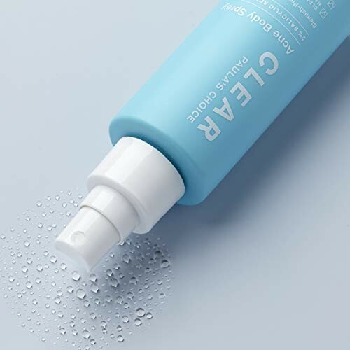 Blue bottle of acne body spray with water droplets