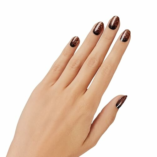 Hand with glittery brown nail art on fingernails