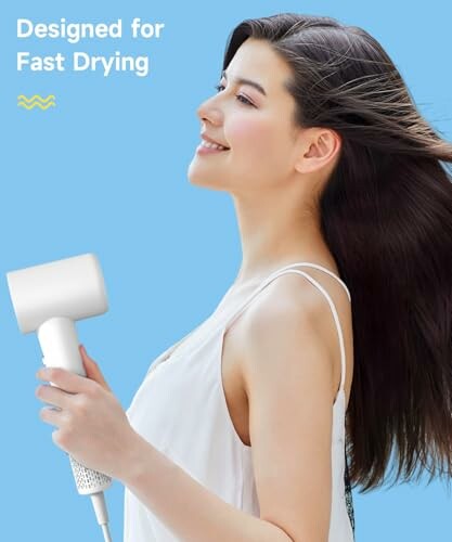 Woman using hair dryer for fast drying