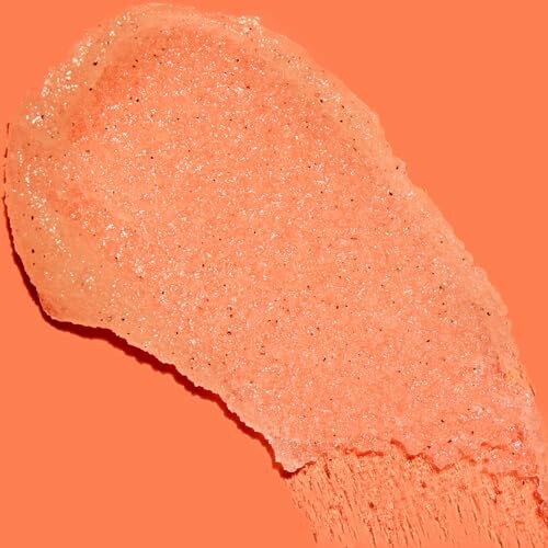 Peach glitter texture on orange background